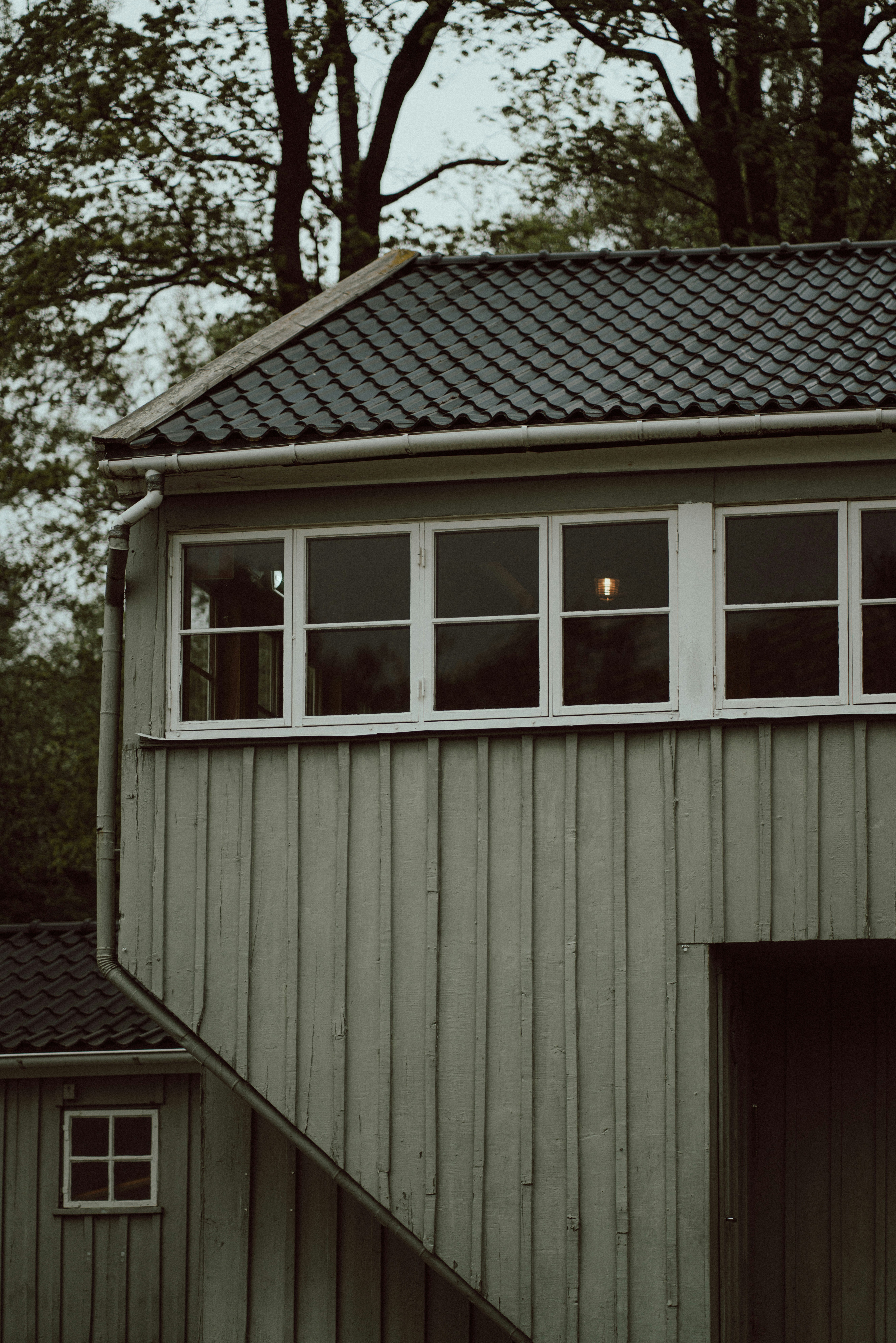 a couple of windows on the side of a building