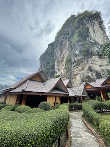 a house with a mountain in the background