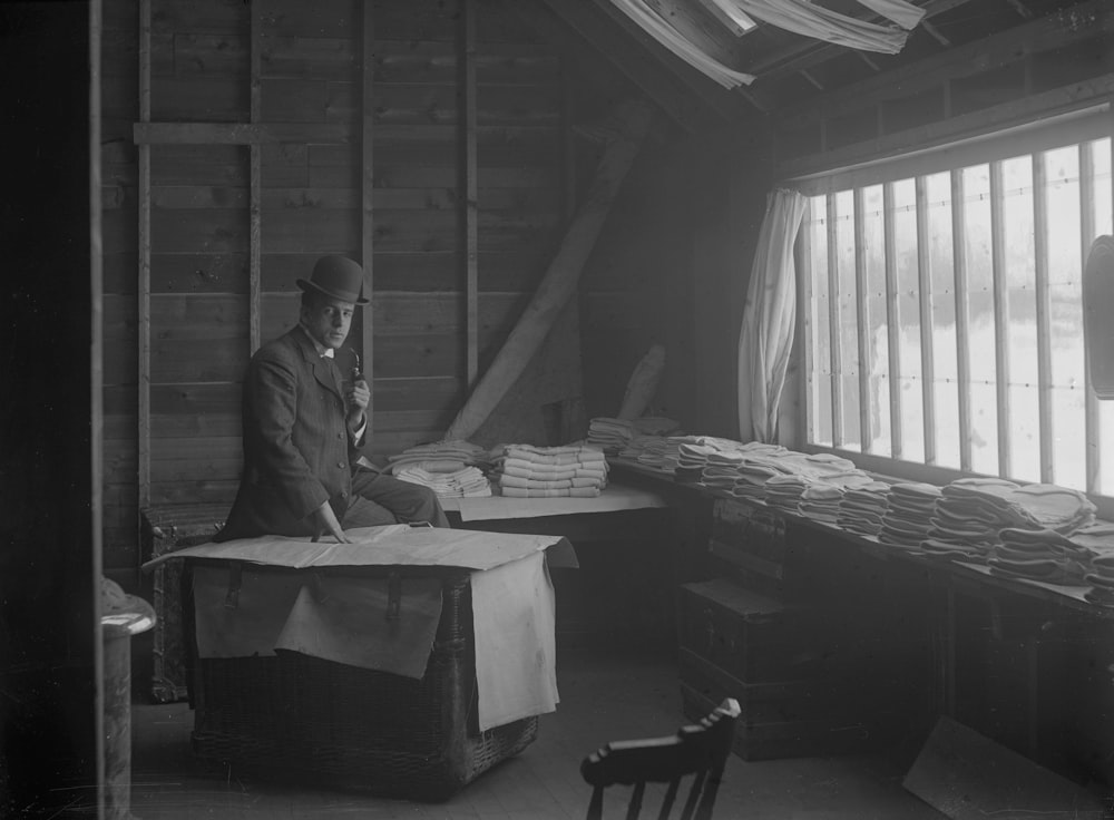 a man sitting on a box in a room