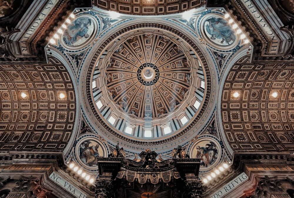 the ceiling of a large building with a domed ceiling