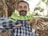 A happy customer holding a reptile product from Reptivibe.