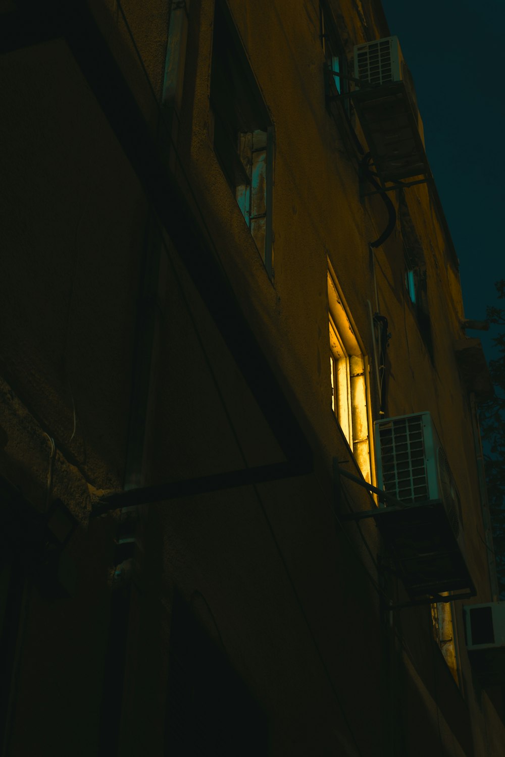 a building with a window and a street light