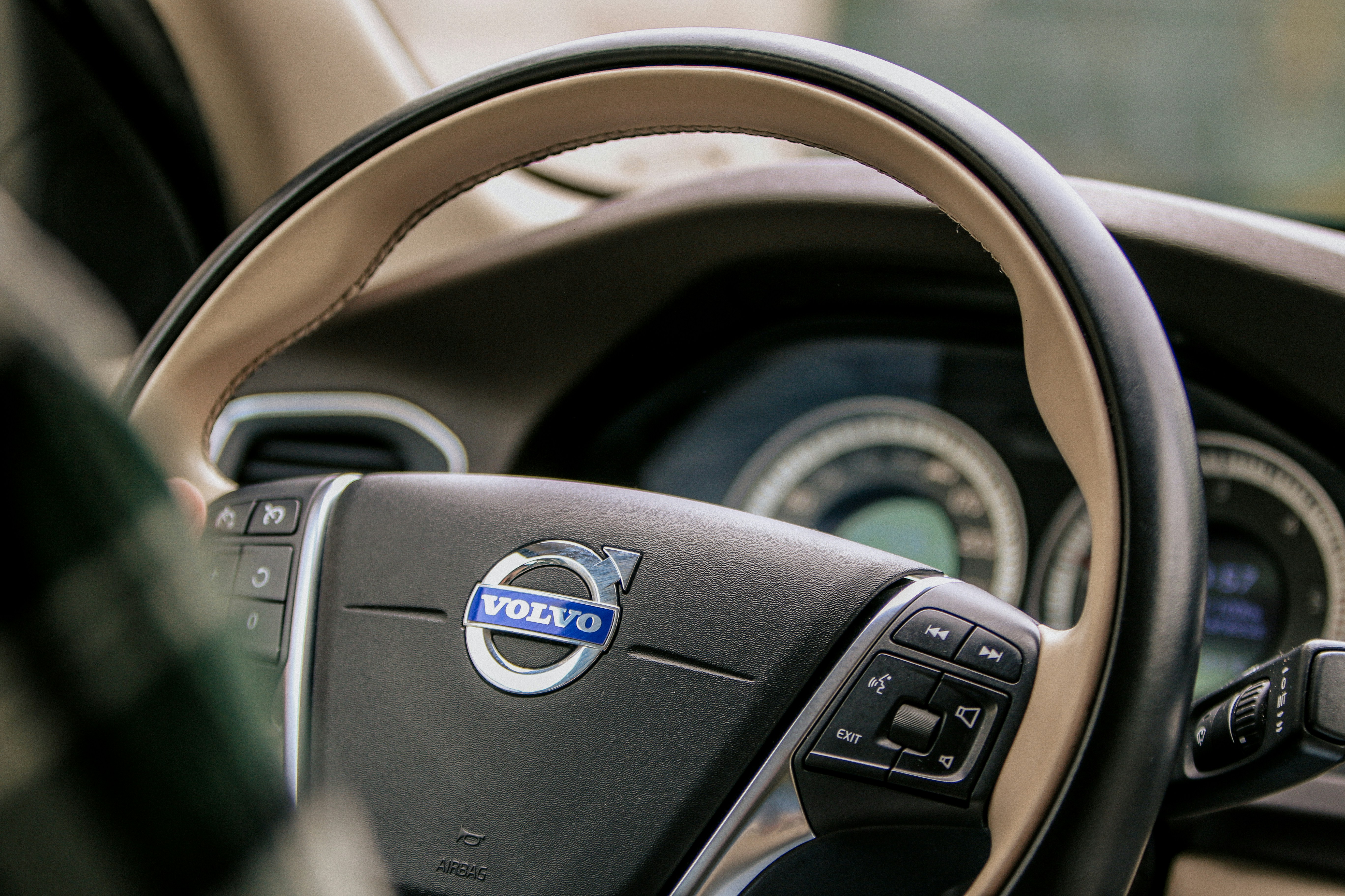 a close up of a steering wheel of a car