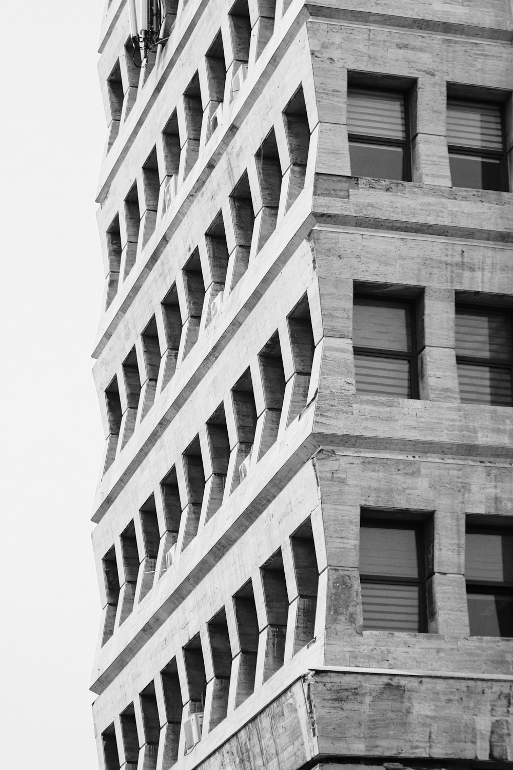 a black and white photo of a tall building