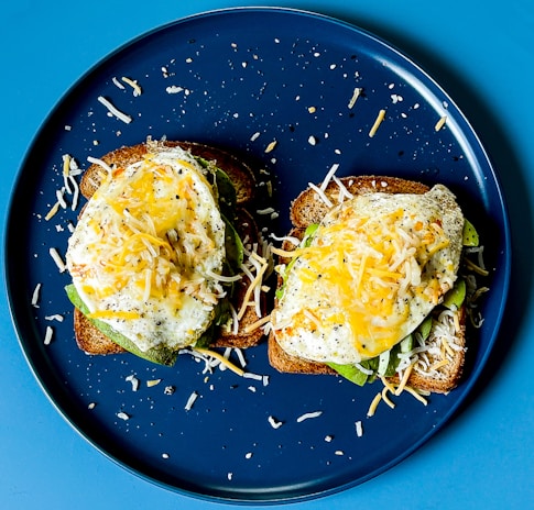 A beautifully arranged breakfast plate with eggs and avocado.