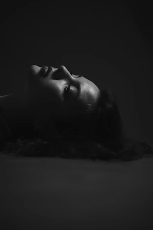 Side profile showing a woman’s defined jawline and smooth skin post-treatment.