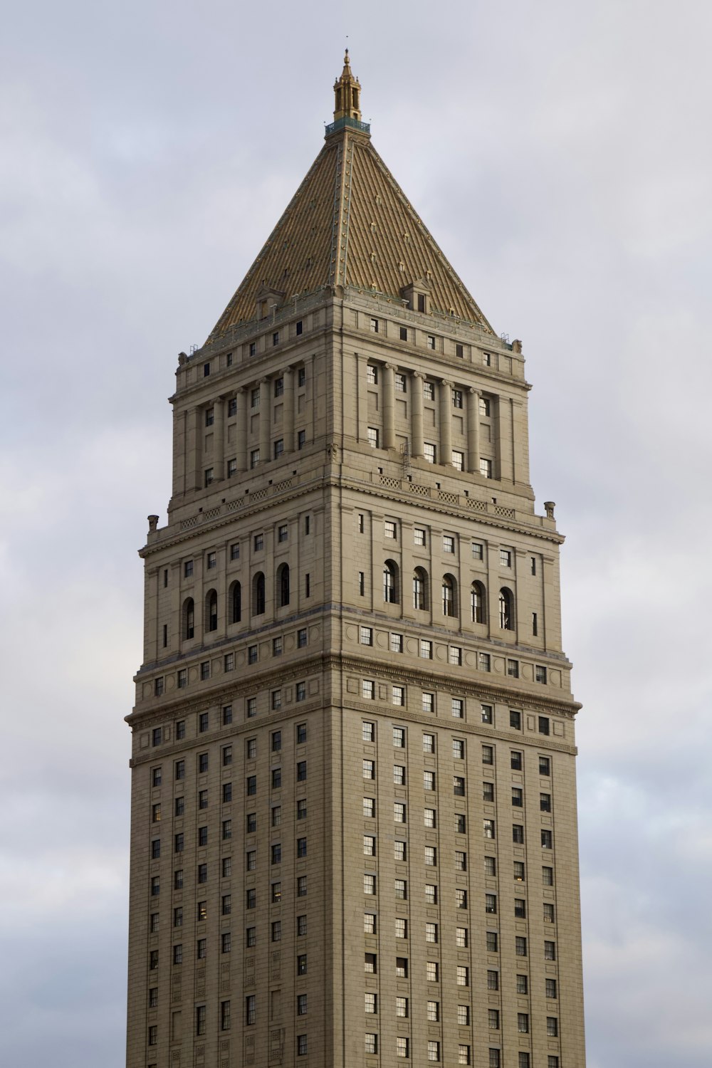 a tall building with a clock on the top of it