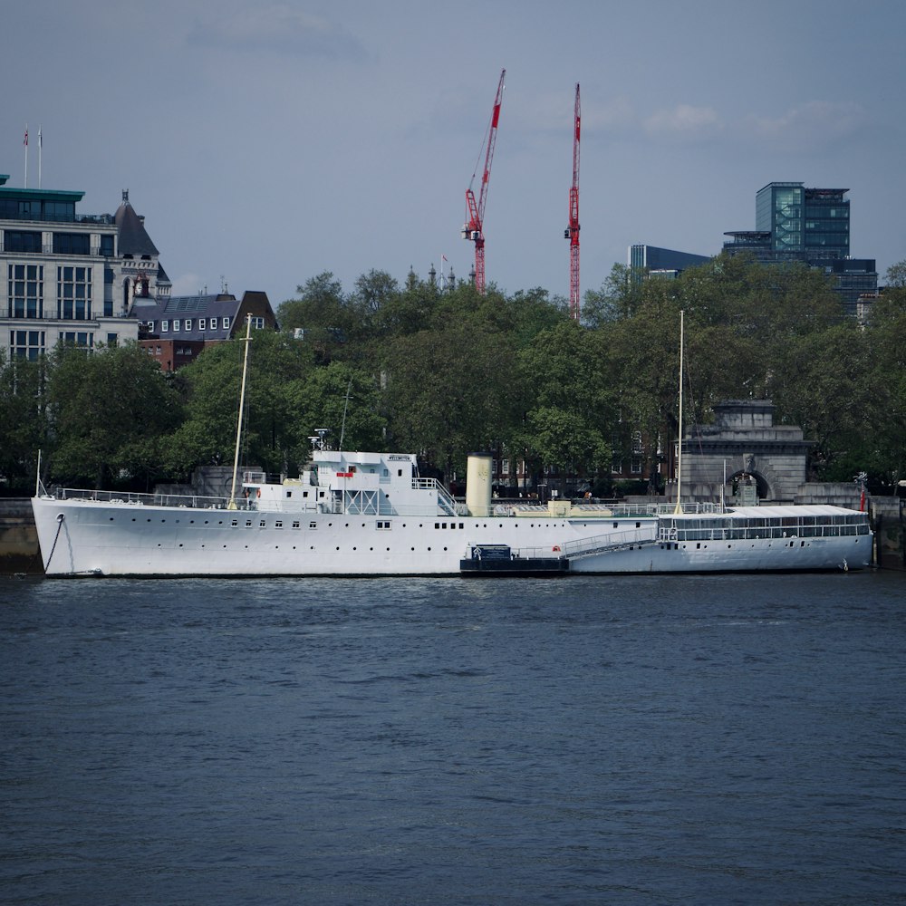 a large white boat floating on top of a body of water