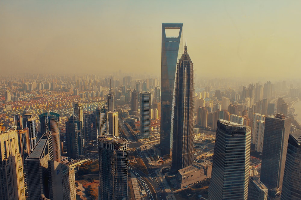 an aerial view of a city with tall buildings