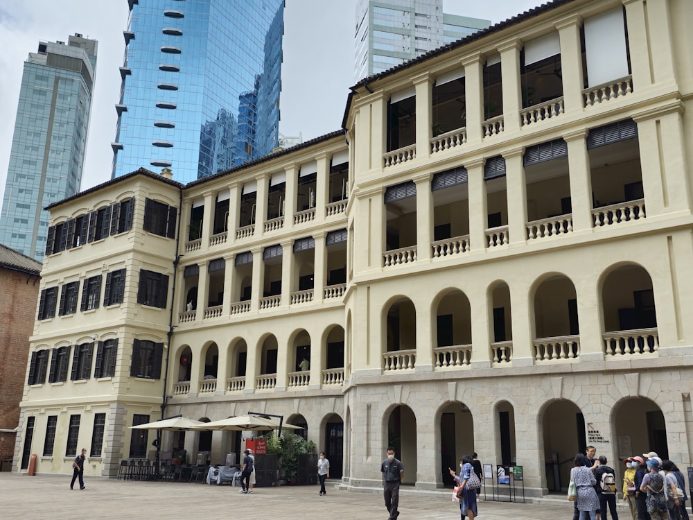 a group of people standing in front of a building