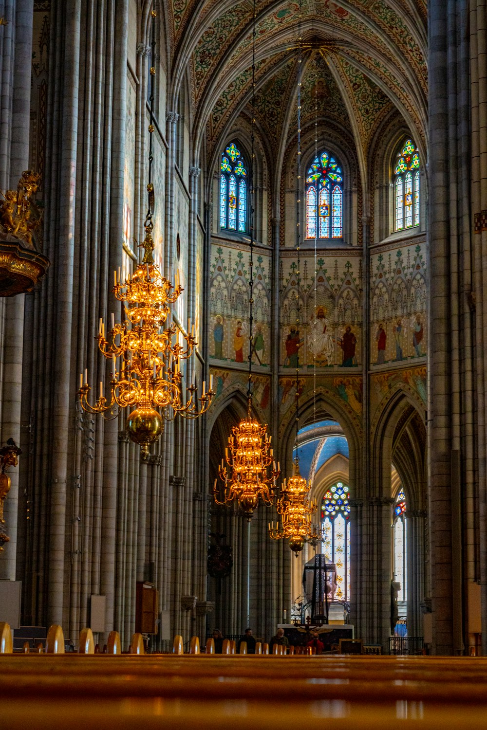 a cathedral with chandeliers hanging from the ceiling