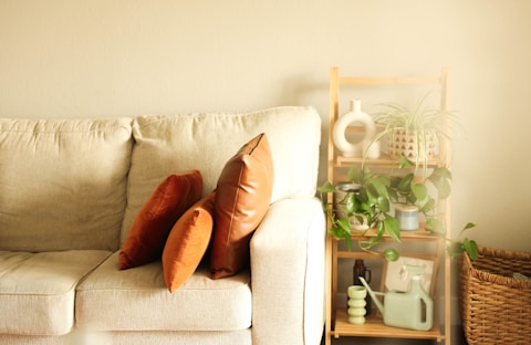 a white couch with two pillows on it