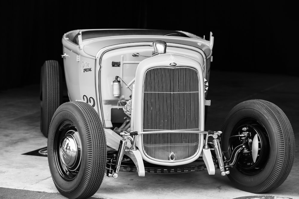 a vintage car is parked in a garage