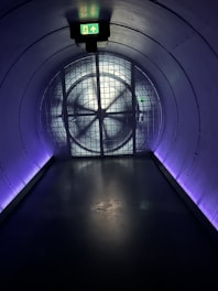 a tunnel with a clock on the wall