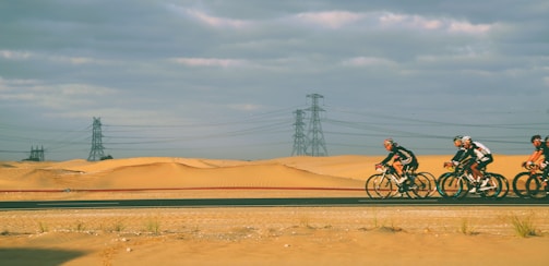 Cyclists riding through a scenic desert trail in Atacama.