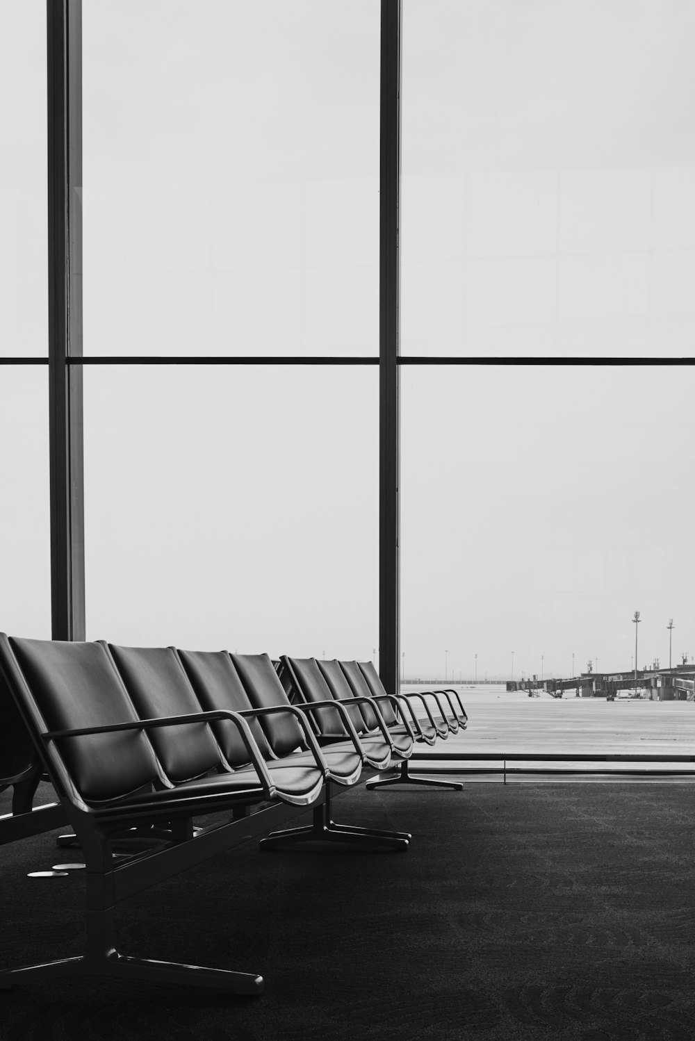 a row of chairs sitting in front of a window