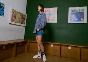 Avatar wearing a casual outfit with a denim jacket and sneakers in a bright room