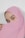 A close-up of a person's face partially covered by a pink headscarf, with expressive eyes prominently visible. The fabric drapes gracefully, creating a soft, elegant look.