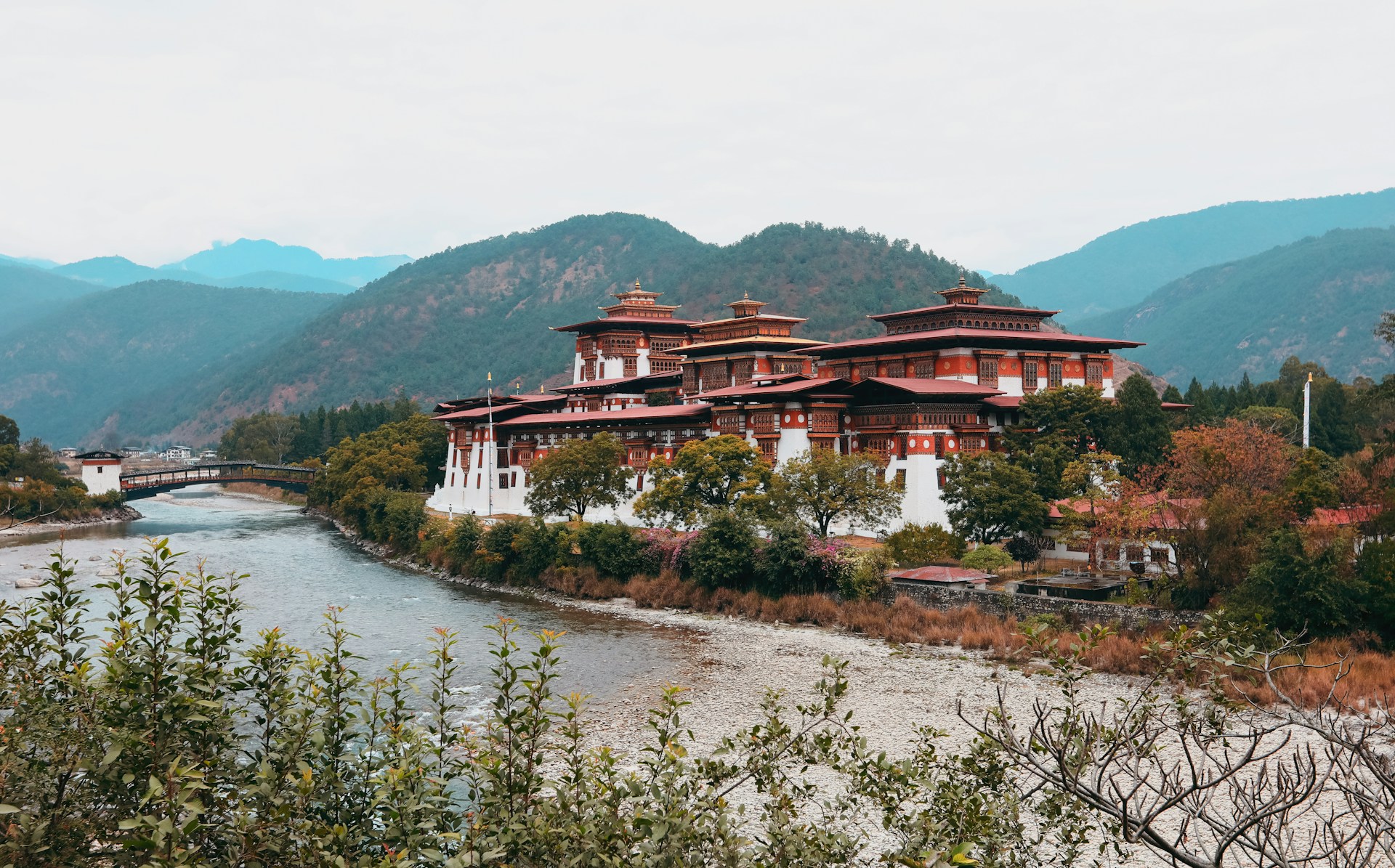 woman wearing yellow long-sleeved dress under white clouds and blue sky during daytime