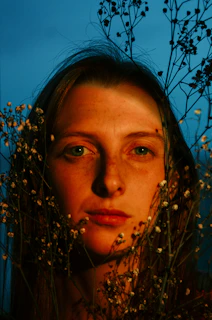 A warm, inviting portrait of a passionate person smiling gently, surrounded by elements that represent their dream and expertise.