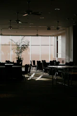 Families gathered in a calm, sensory-safe room filled with plants and soft lighting.