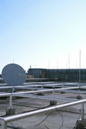 Wide shot of a rooftop with multiple antennas installed by Leansat.