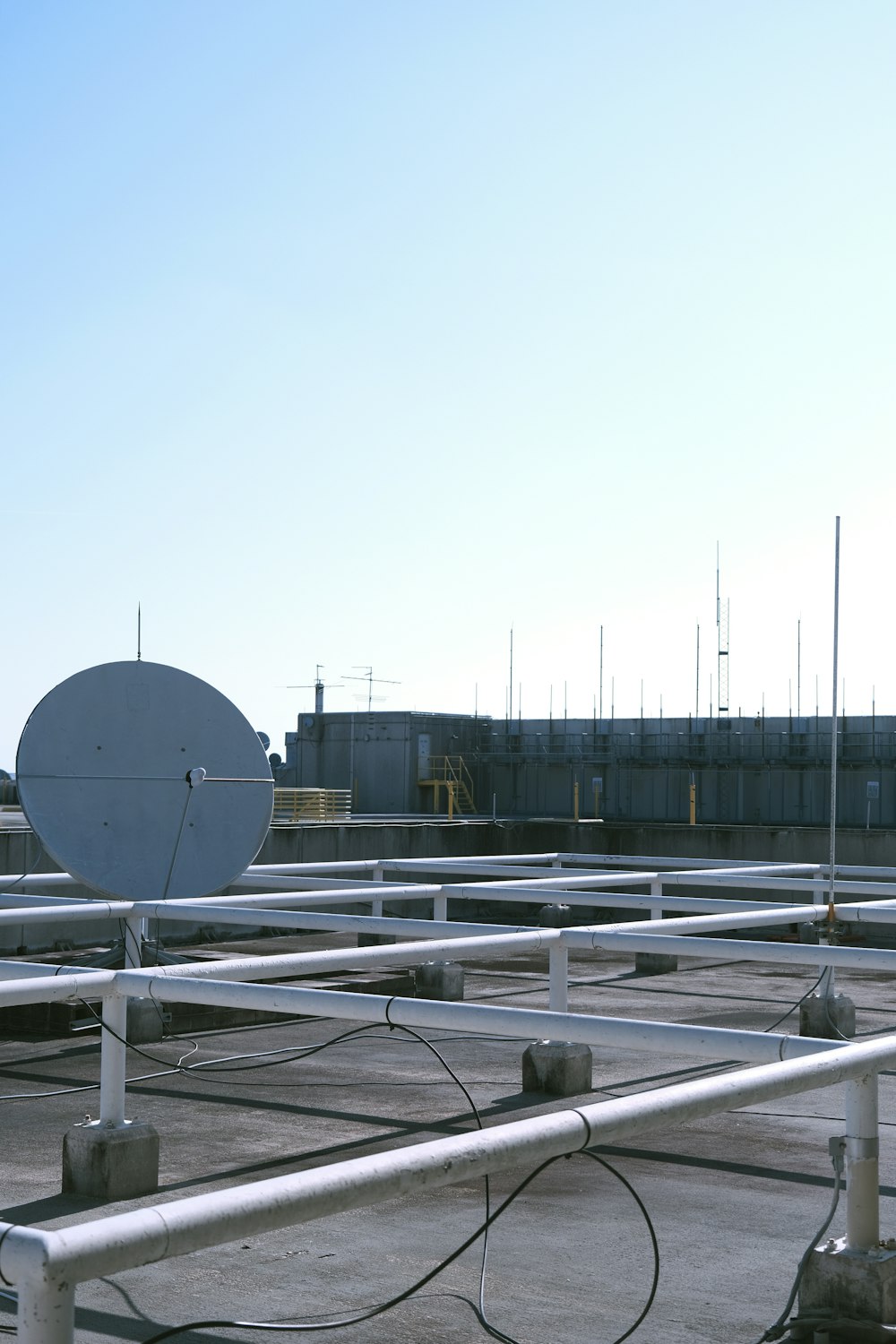 a large satellite dish sitting on top of a roof