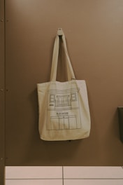 a canvas bag hanging on a wall