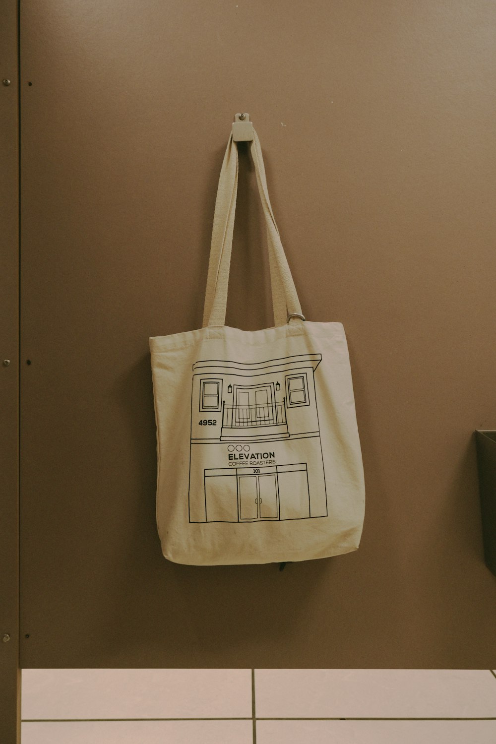 a canvas bag hanging on a wall