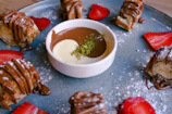 A colorful spread of pisang crispy with three distinctive sauces in small bowls