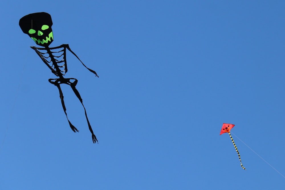 a kite that looks like a skeleton flying in the sky