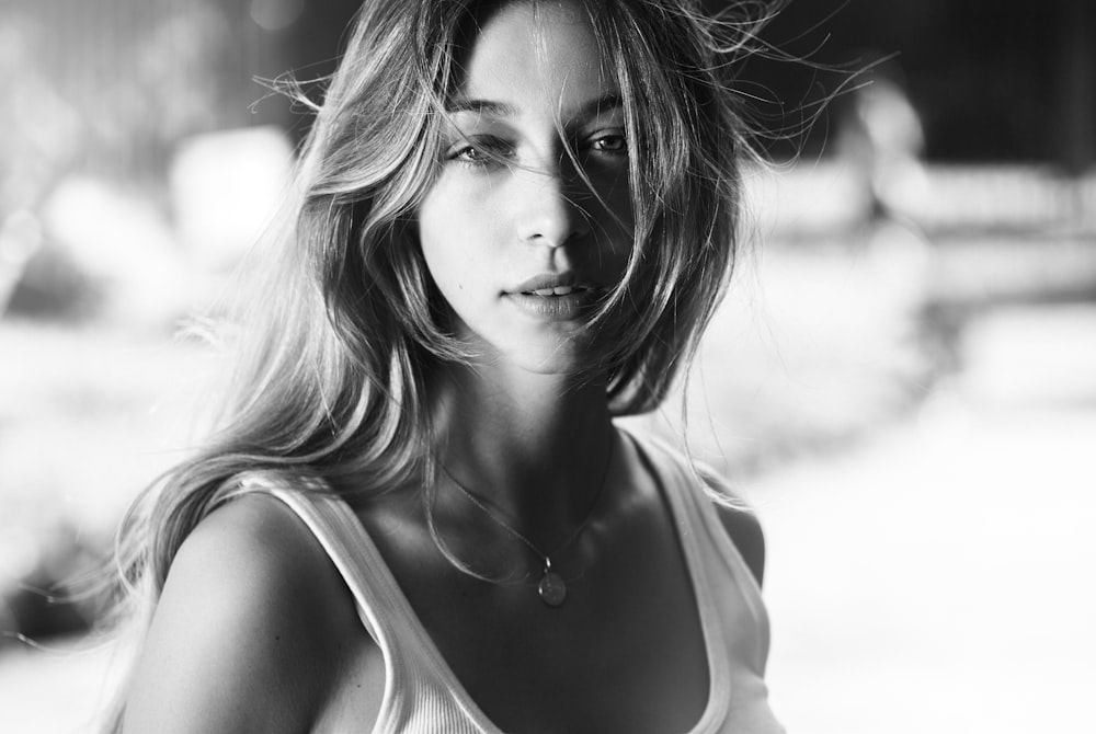 a black and white photo of a woman with long hair