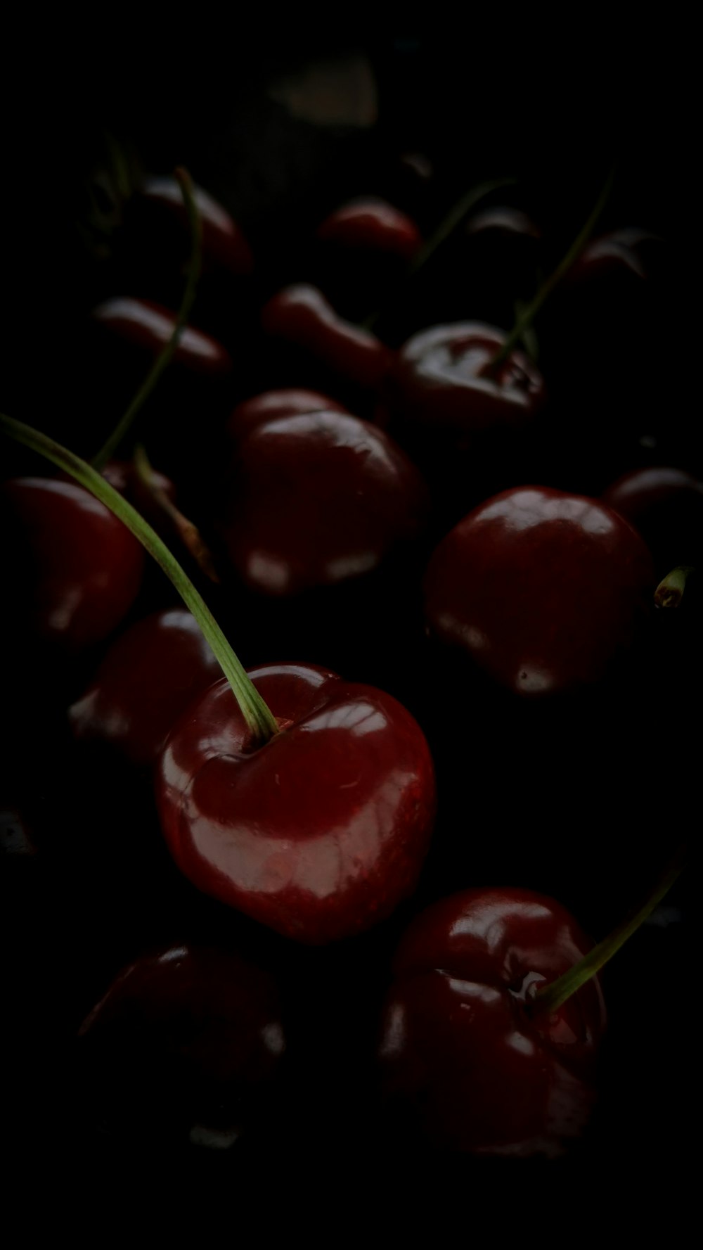 a group of cherries sitting on top of each other