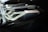 Close-up of a sleek car headlight featuring intricate design details and metallic accents. The headlight is part of a modern vehicle with a sophisticated lighting system, indicated by the 'BMW Laser' branding.