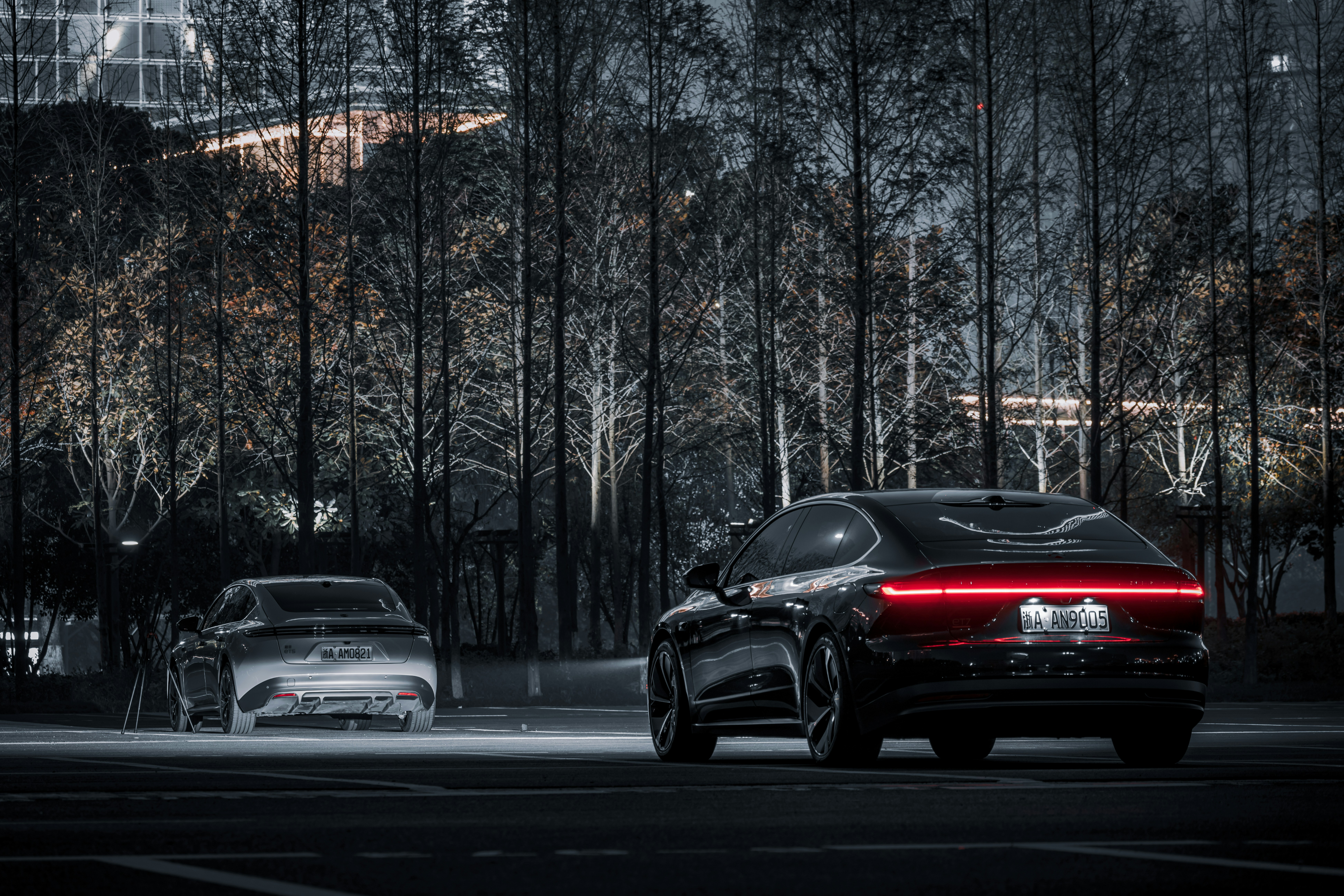 a couple of cars that are sitting in the street