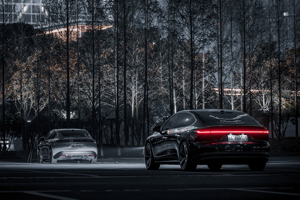 a couple of cars that are sitting in the street