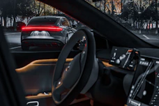 the interior of a car with the lights on