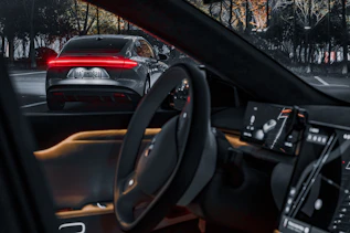 the interior of a car with the lights on