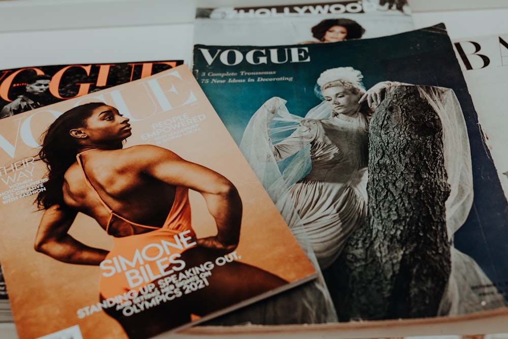 a pile of magazines sitting on top of a table