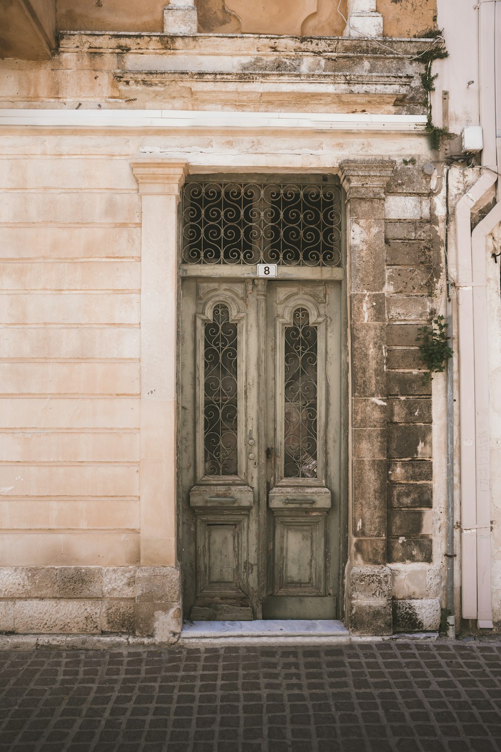 an old building with a door and window