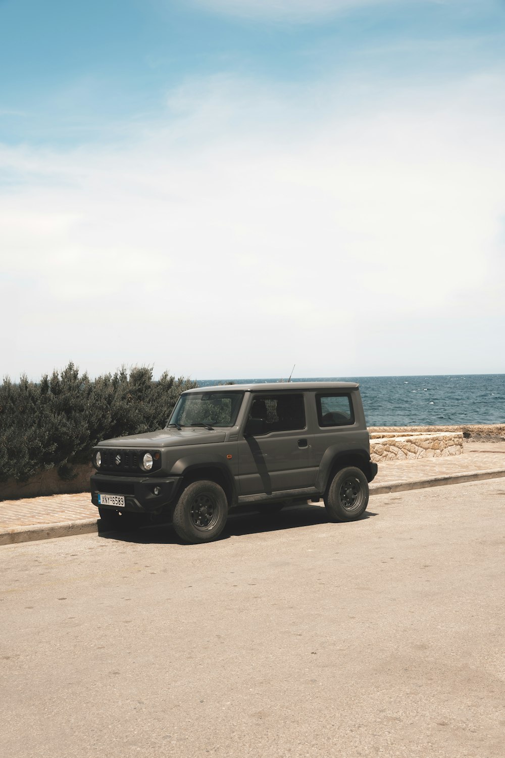 a black jeep parked on the side of the road