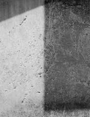 Before and after split image showing grime removal on a concrete driveway.