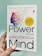 A hand is holding a book titled 'The Power of Your Subconscious Mind' by Dr. Joseph Murphy. The cover features a silhouette of a head with a colorful array of birds flying away from it, symbolizing thoughts or ideas. There is a yellow circle indicating 'Millions of Copies Sold.'