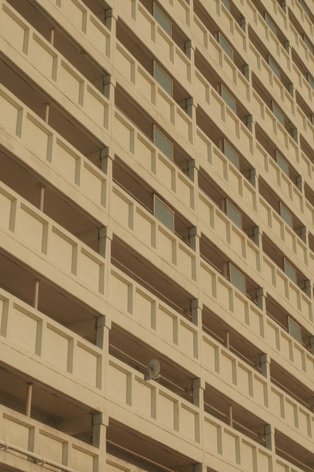 a tall building with balconies on the side of it