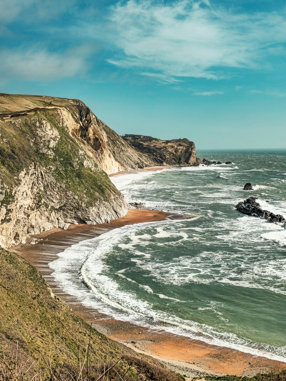 a view of the ocean from a cliff