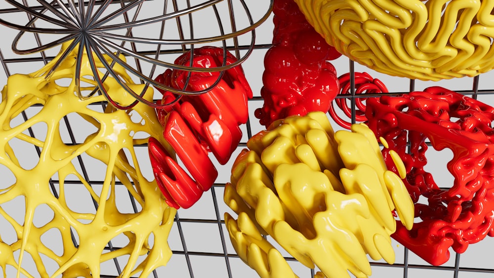 a bunch of different colored objects hanging from a wire rack