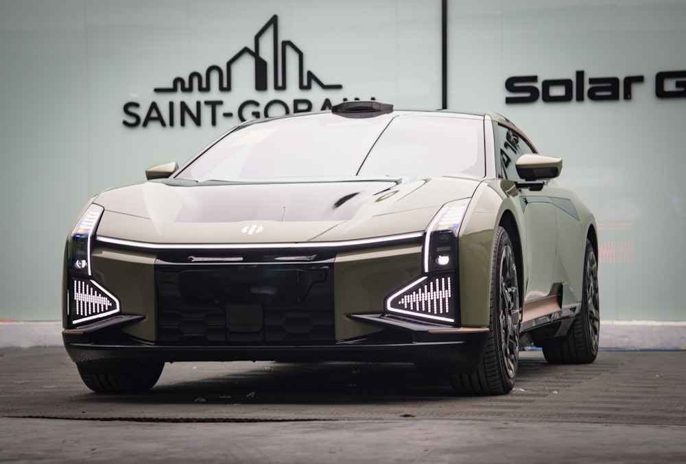 a futuristic car parked in front of a building