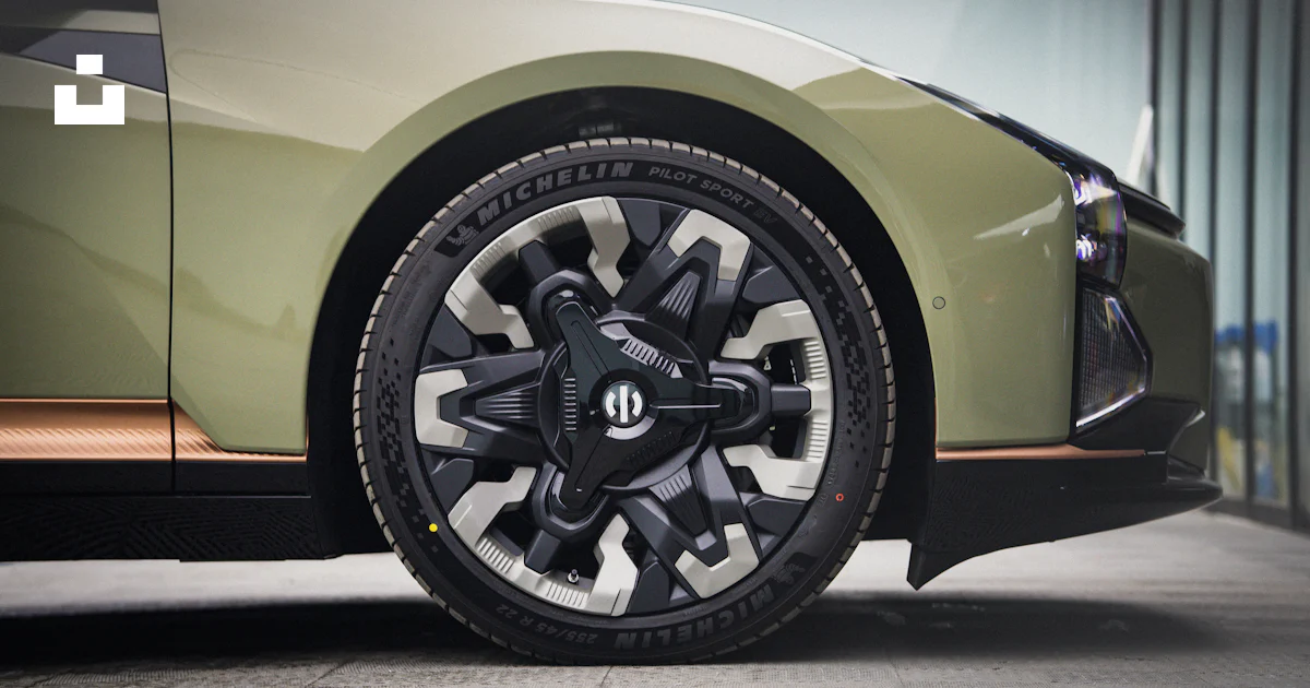 A close up of a car tire on a street photo – Free Car closeup Image on ...