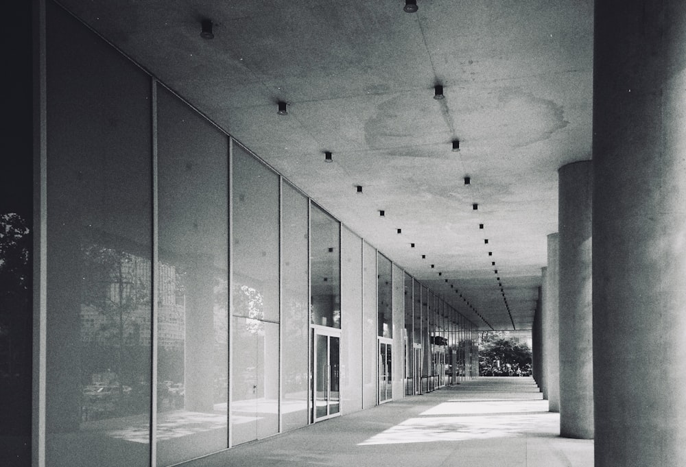 a black and white photo of a long hallway