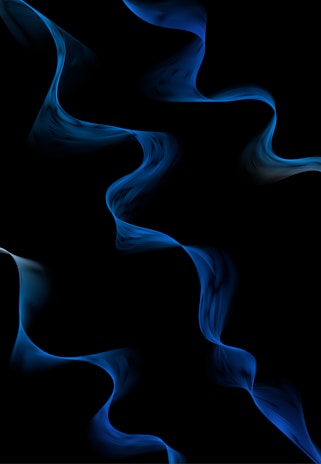 A close-up shot of electric blue soundwave patterns glowing softly against a charcoal background.